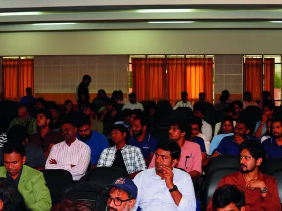 A full hall of delegates listening to a session