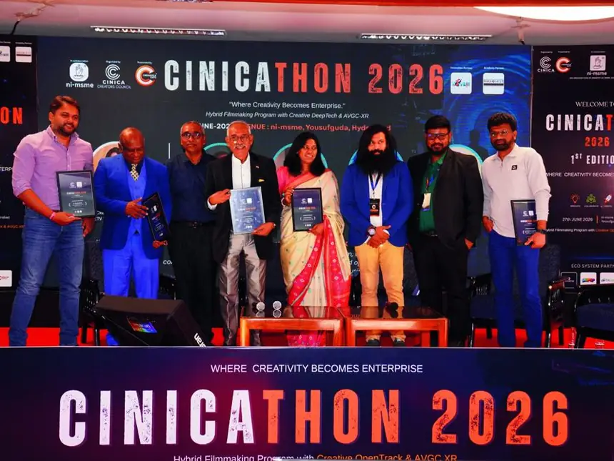 Award winners holding certificates on stage in front of the CINICATHON 2026 backdrop